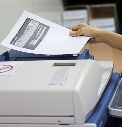 person using photocopier