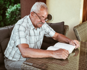 older man reading a book