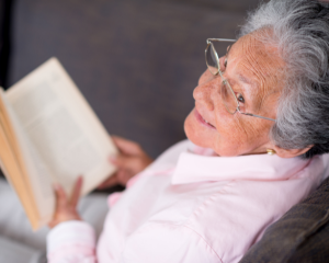 older woman reading a book